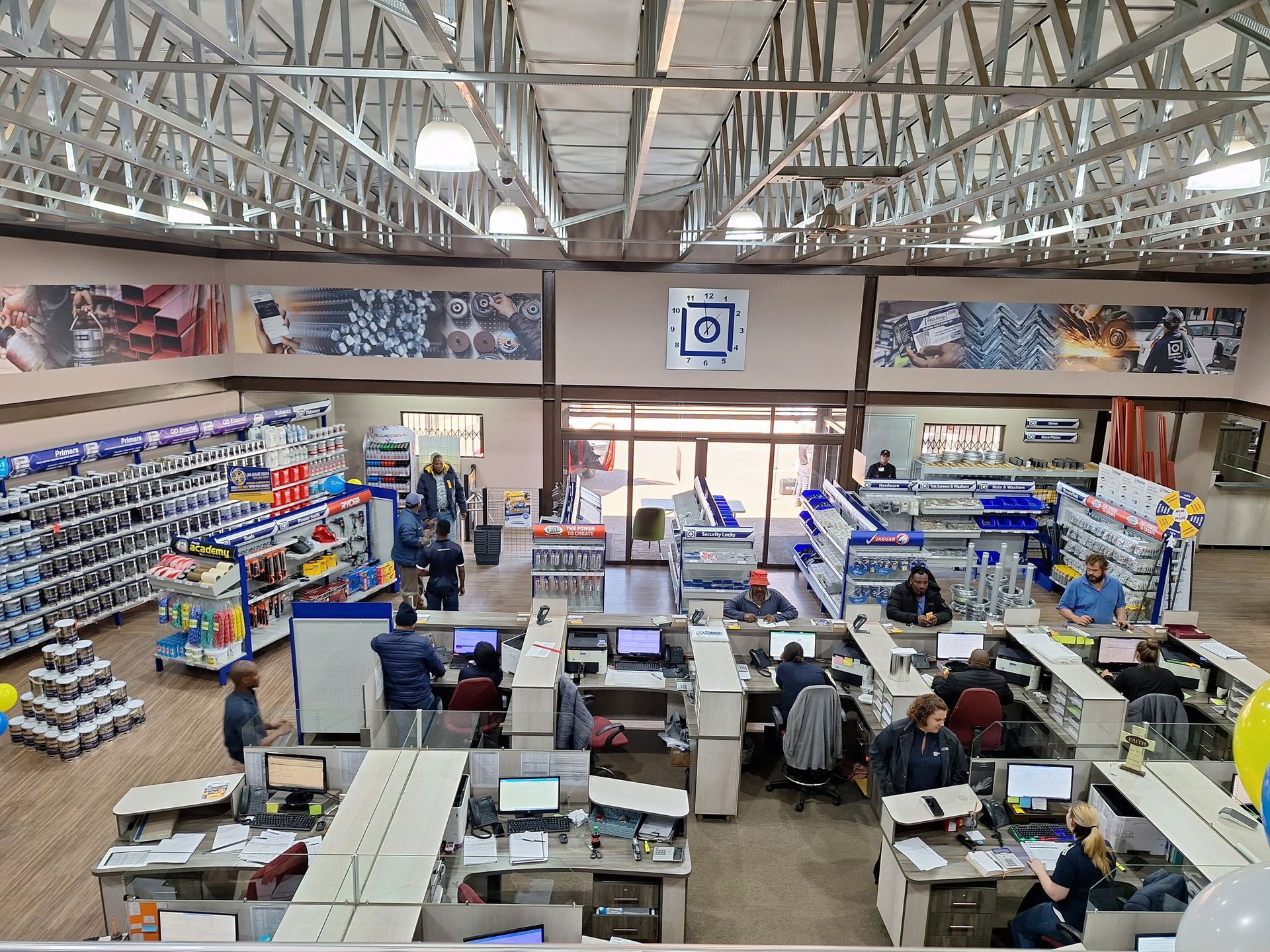 An aerial view of a hardware store with people sitting at desks.