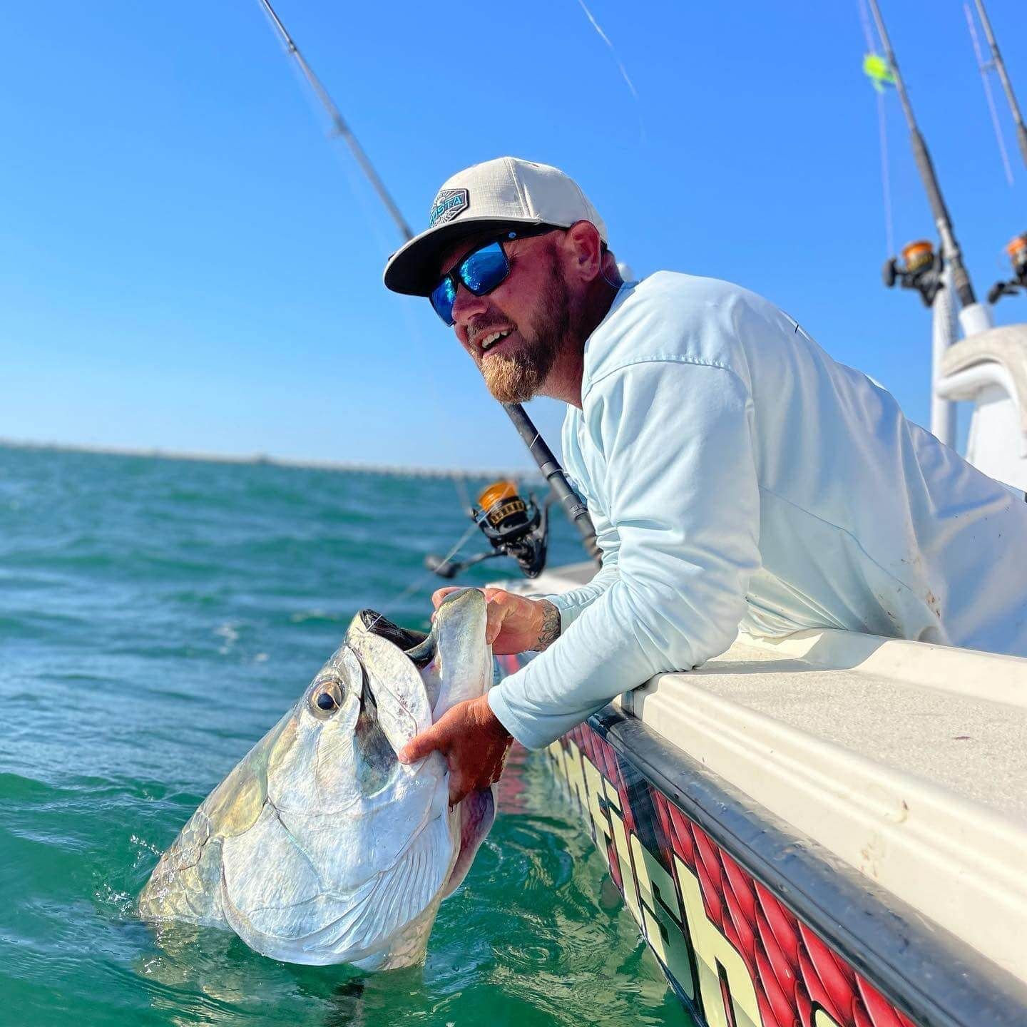 Captain William Wise of Badfish Charters holda big Tarpon.