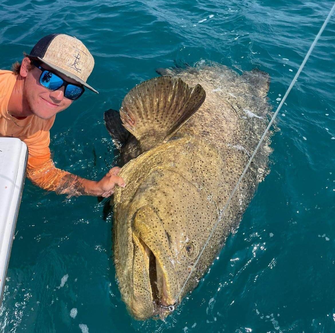 Captain Jake wise holding a Goliath Grouper