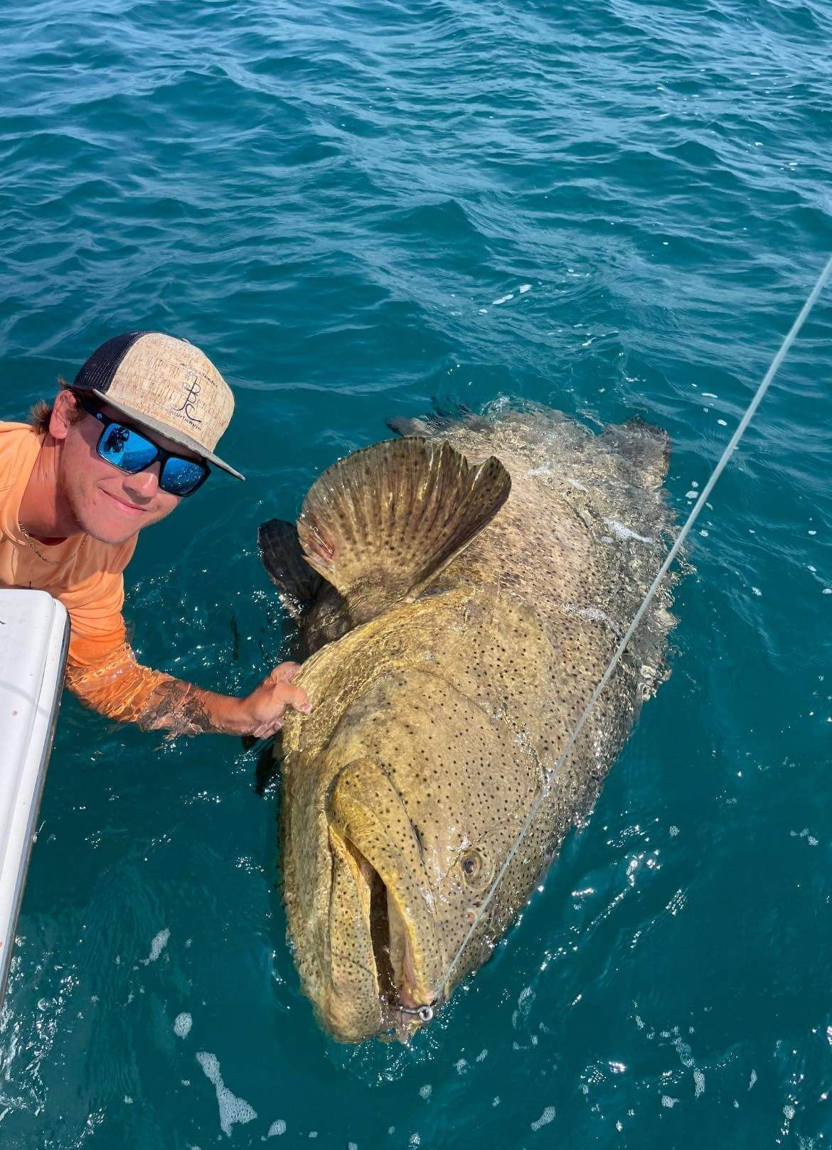 Captain Jake Wise holding a big Goliath Grouper