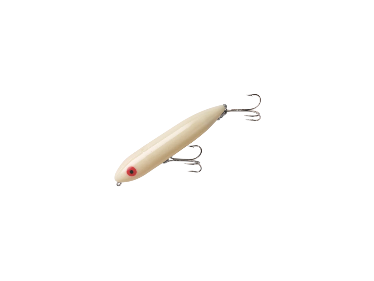 A white zara spook fishing lure with hooks on a white background