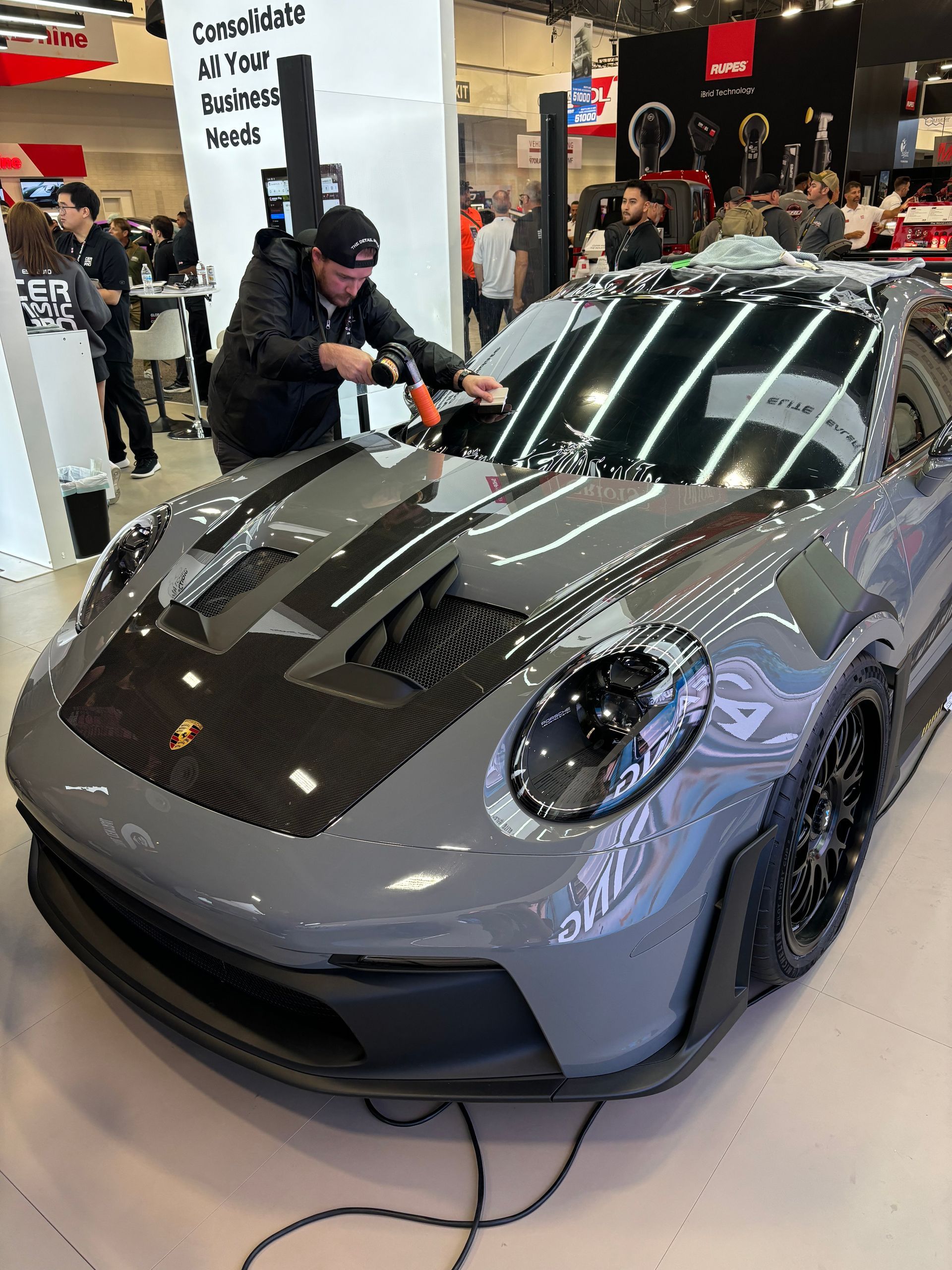 Britt Stokes tinting the windshield of a Porsche 911 GT3RS in Utah.