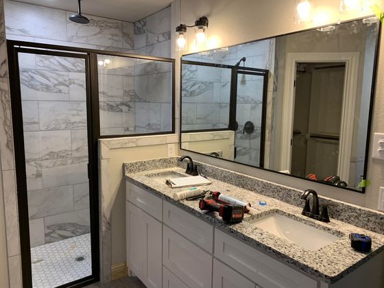 residential bathroom mirror and shower glass door in Abilene, TX