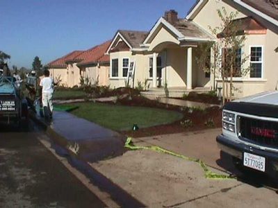 A gmc truck is parked in front of a house