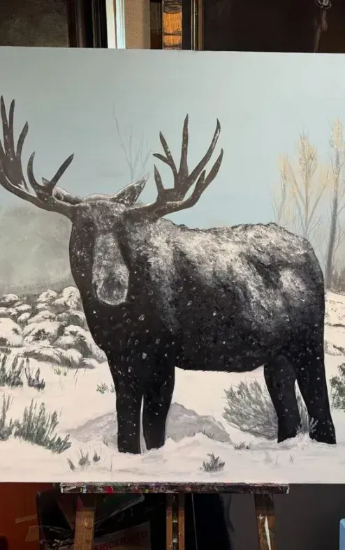 A painting of a moose standing in the snow