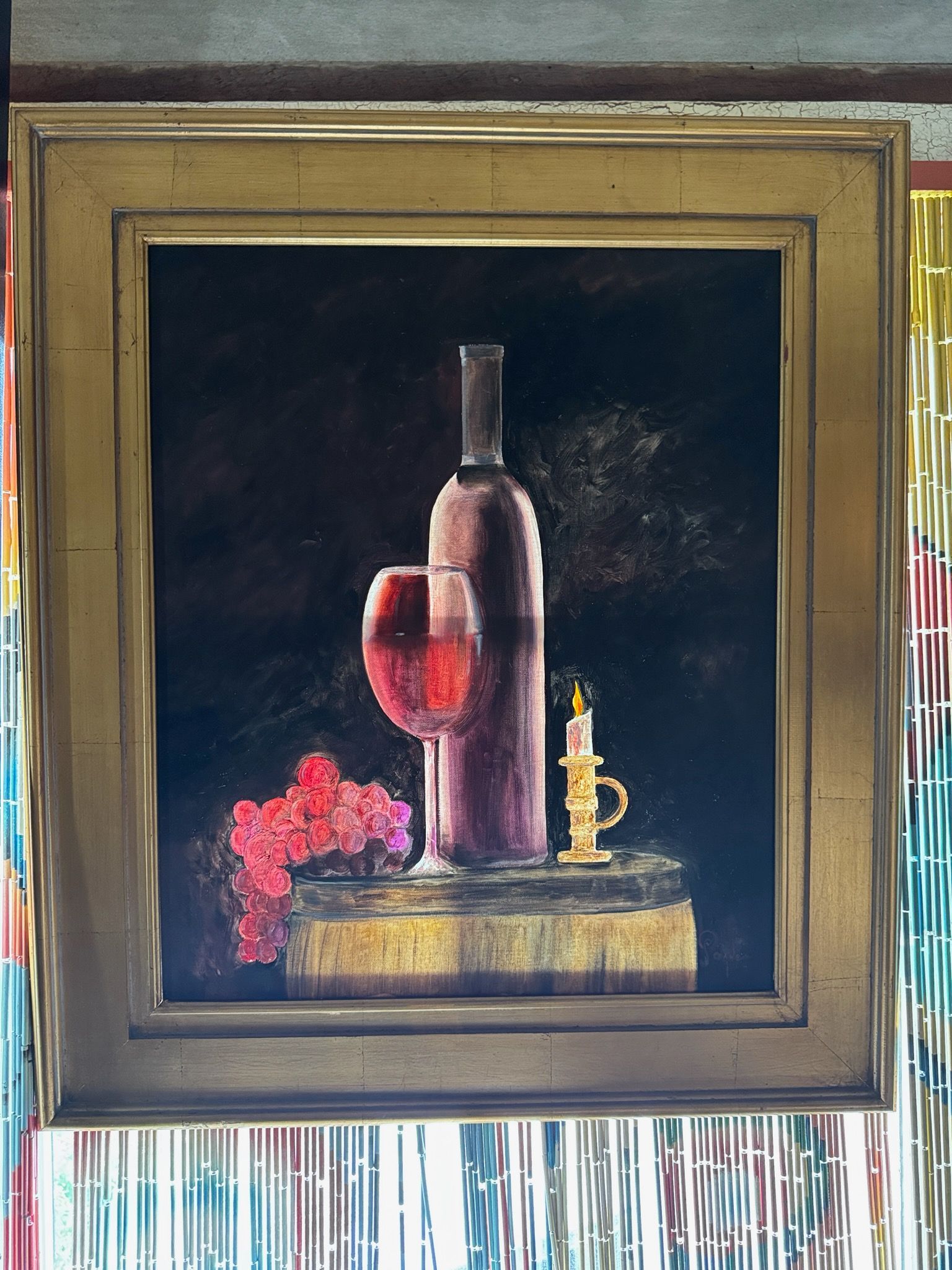 A painting of a bottle of wine a glass and a candle
