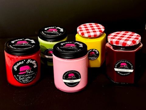 A group of jars with different colored lids are sitting on a table.