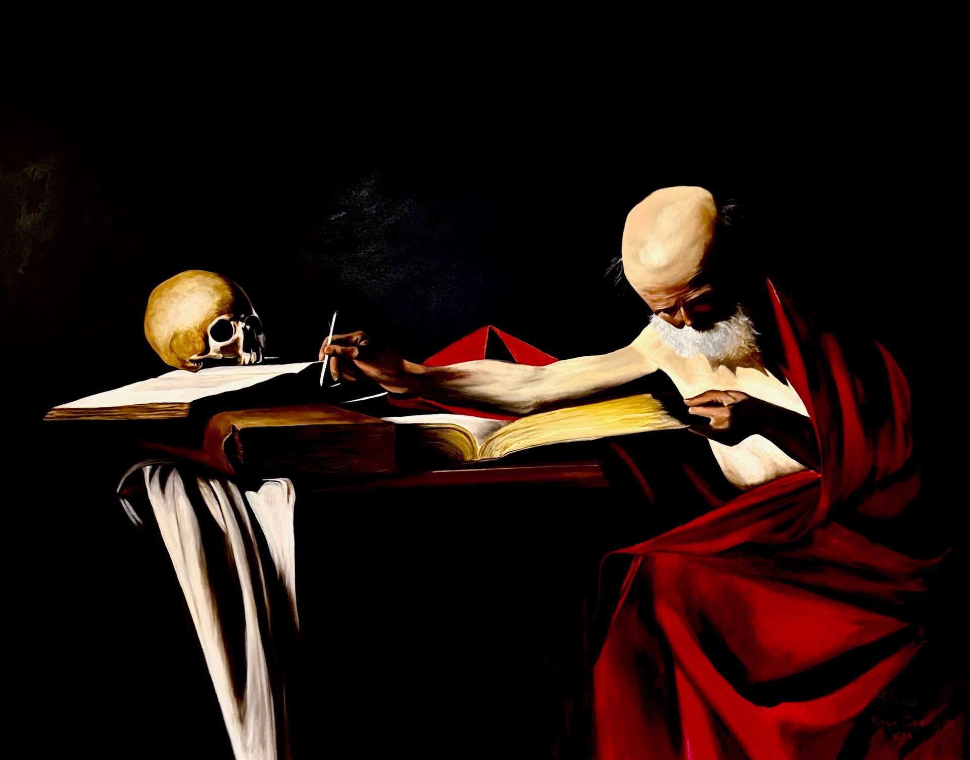 A man in a red robe is reading a book next to a skull.