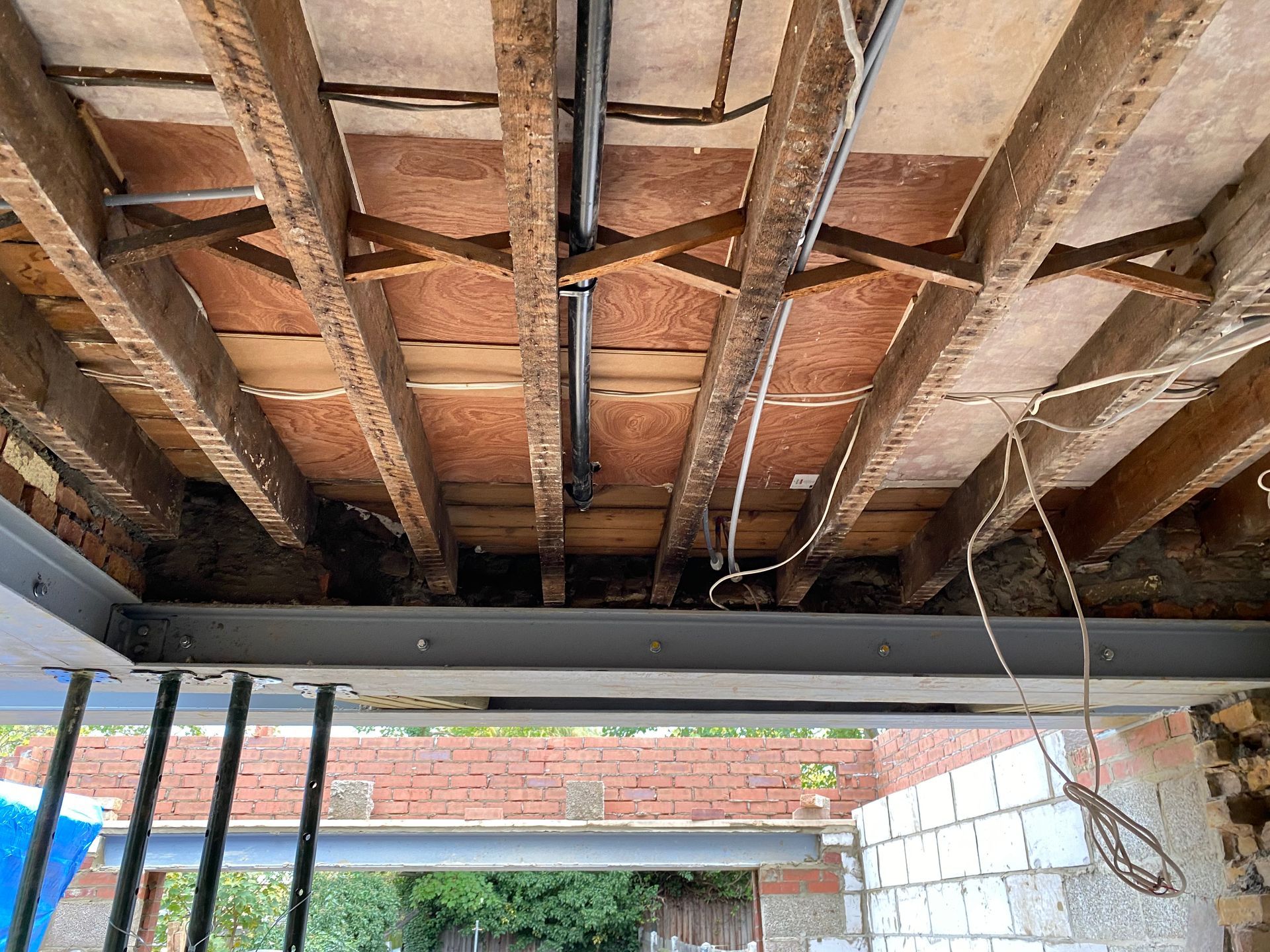 Internal view of structural timber and steel beams for an Ibex Builders project in Walthamstow.