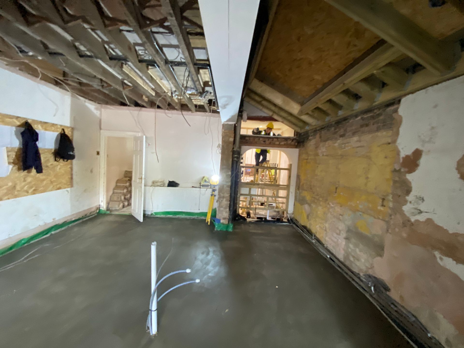 bex Builders installing underfloor heating pipes over insulation for an E17 kitchen extension.