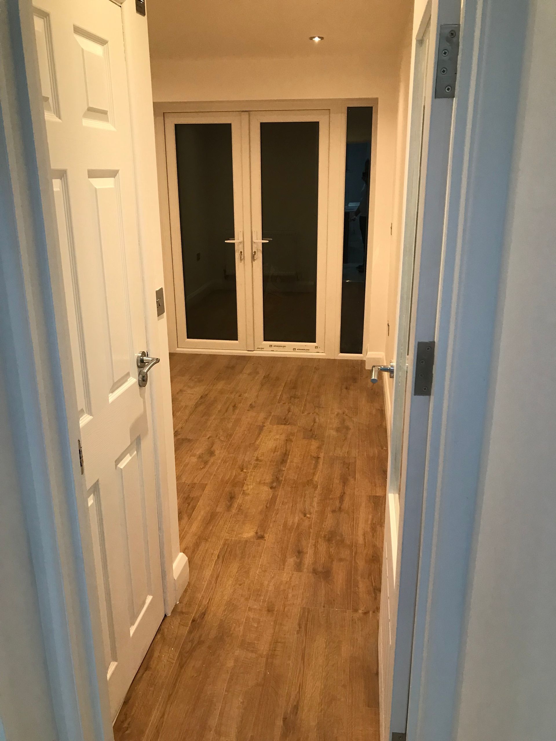 Internal glazed doors connecting spaces in a Walthamstow kitchen extension by Ibex Builders.