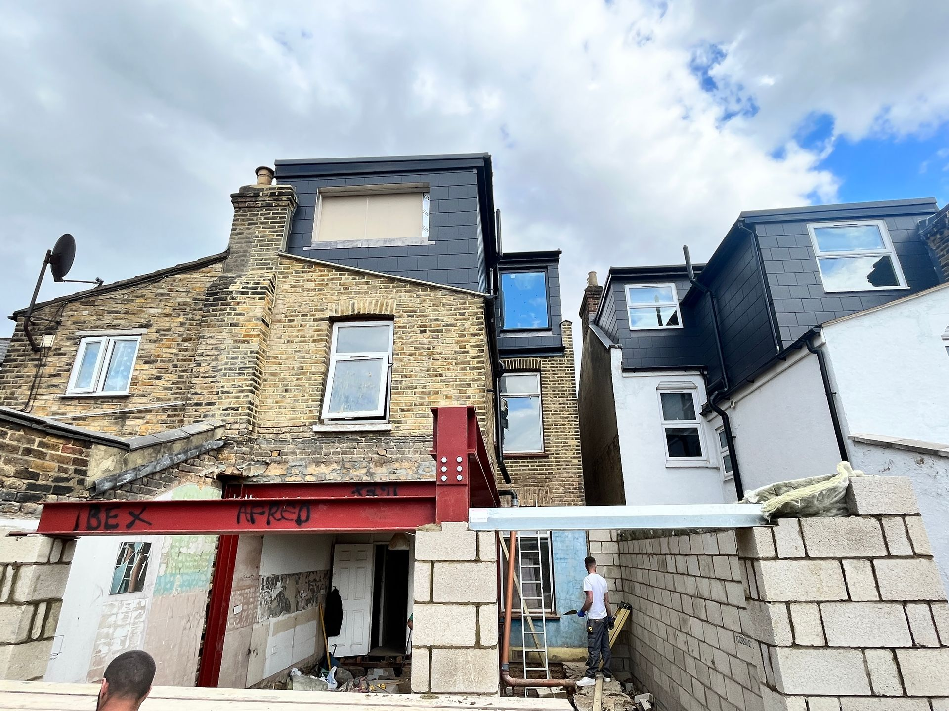 Rear view of L-shape loft and ground floor extension progress in E10 by the Ibex Builders team.