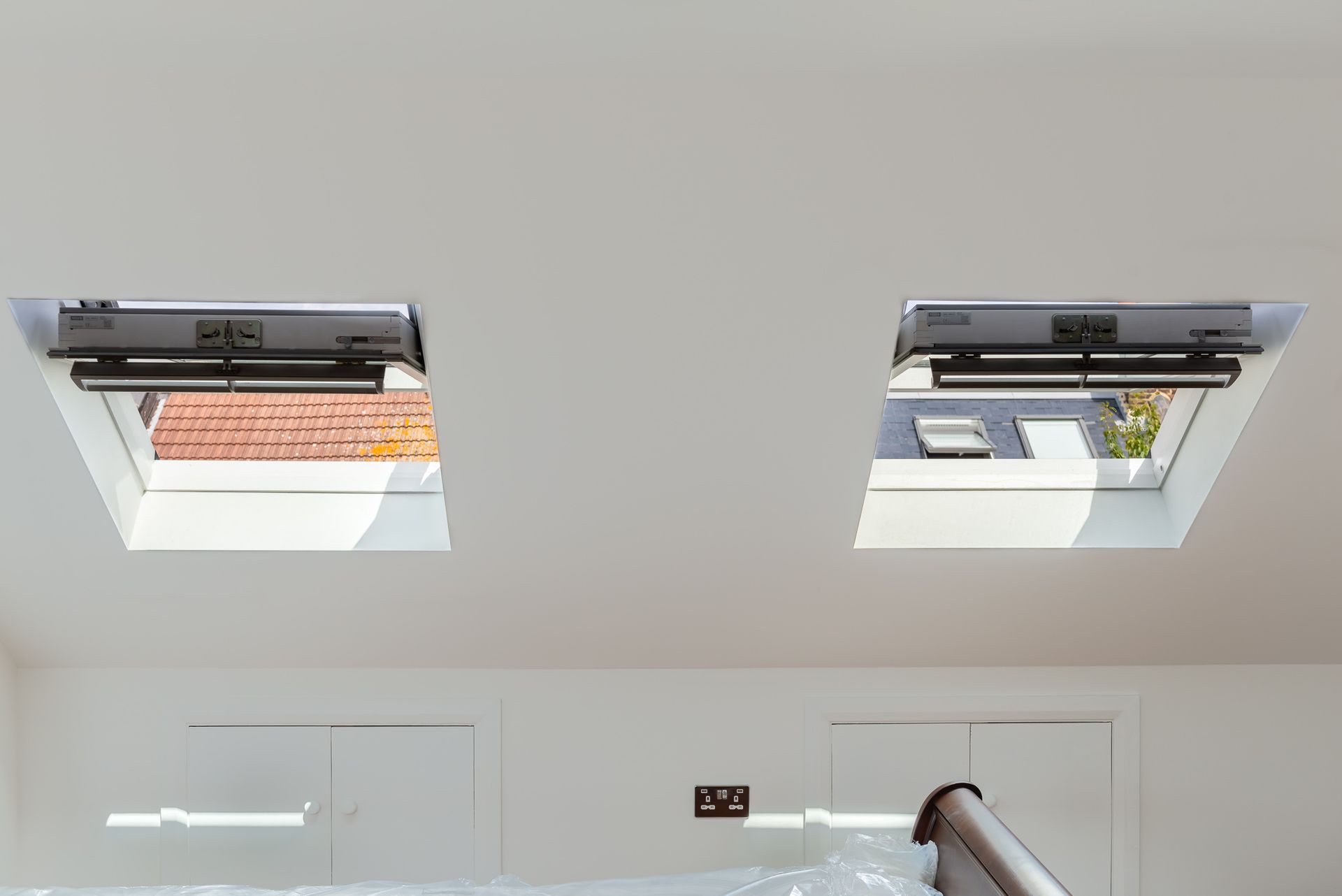 Dual rooflight windows in a bright Walthamstow loft conversion by Ibex Builders.