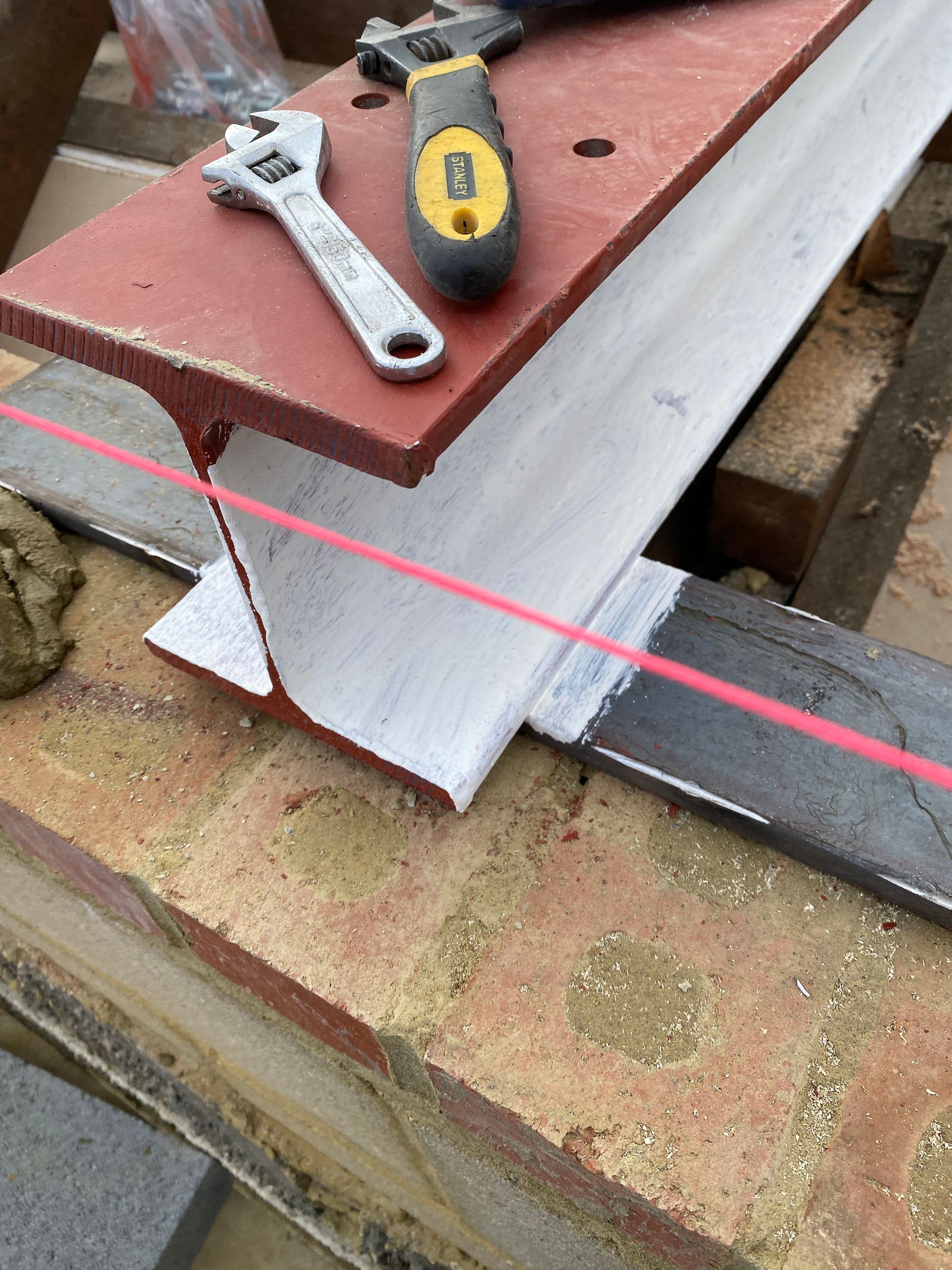 Precision engineering by Ibex Builders: Steel beam installation for a structural loft conversion.