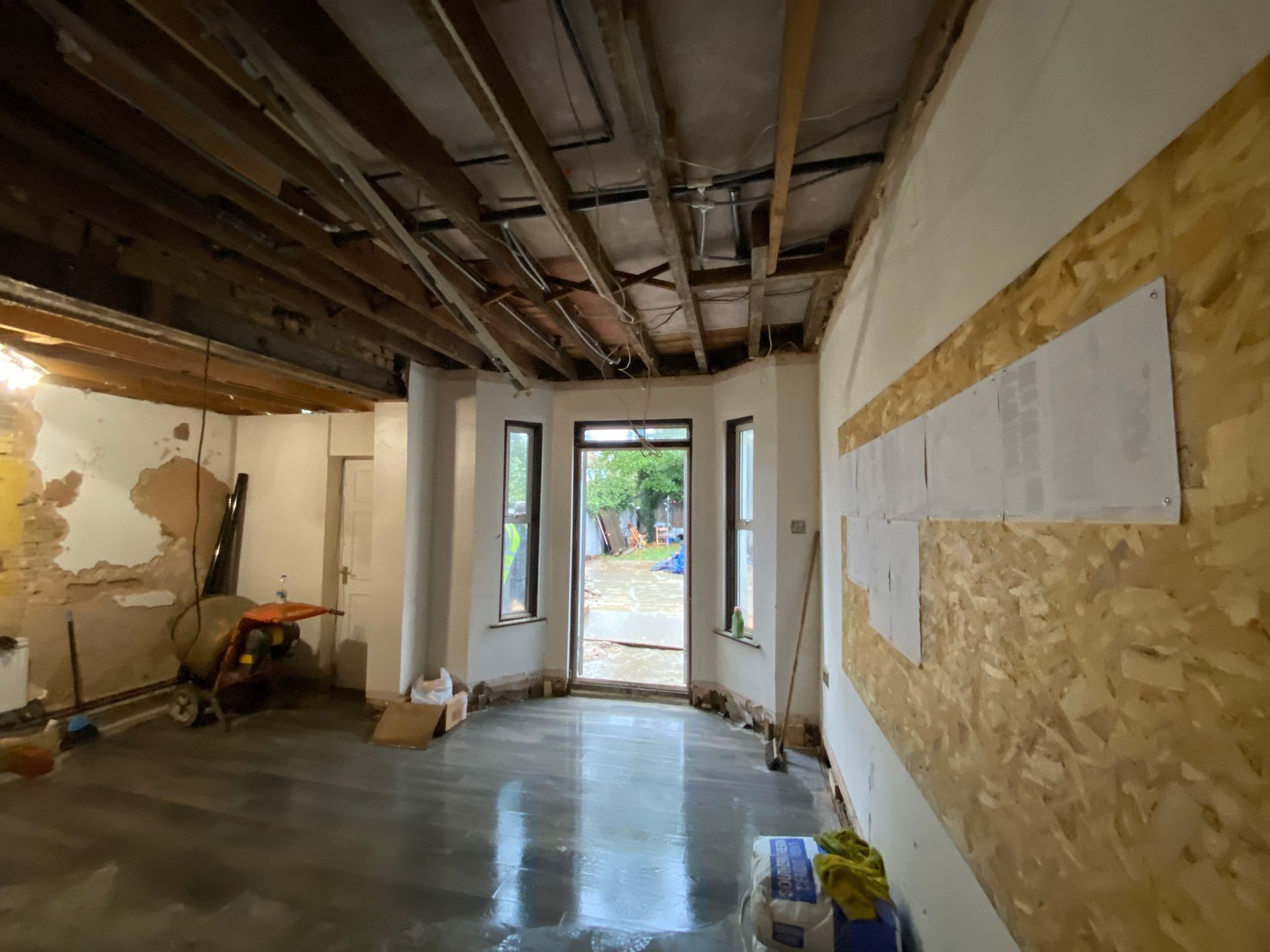 Completed liquid screed flooring inside a Walthamstow E17 kitchen extension by Ibex Builders.