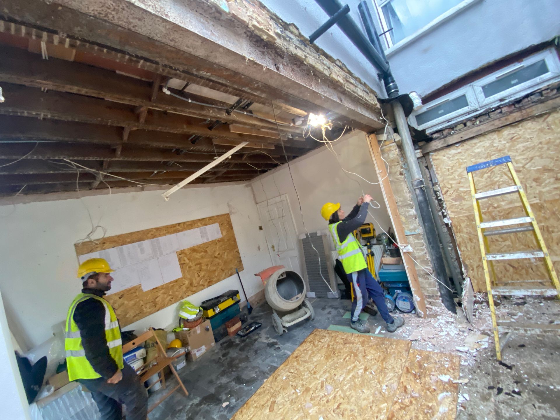 Ibex Builders team working on ceiling joists and steel for a Walthamstow home extension.