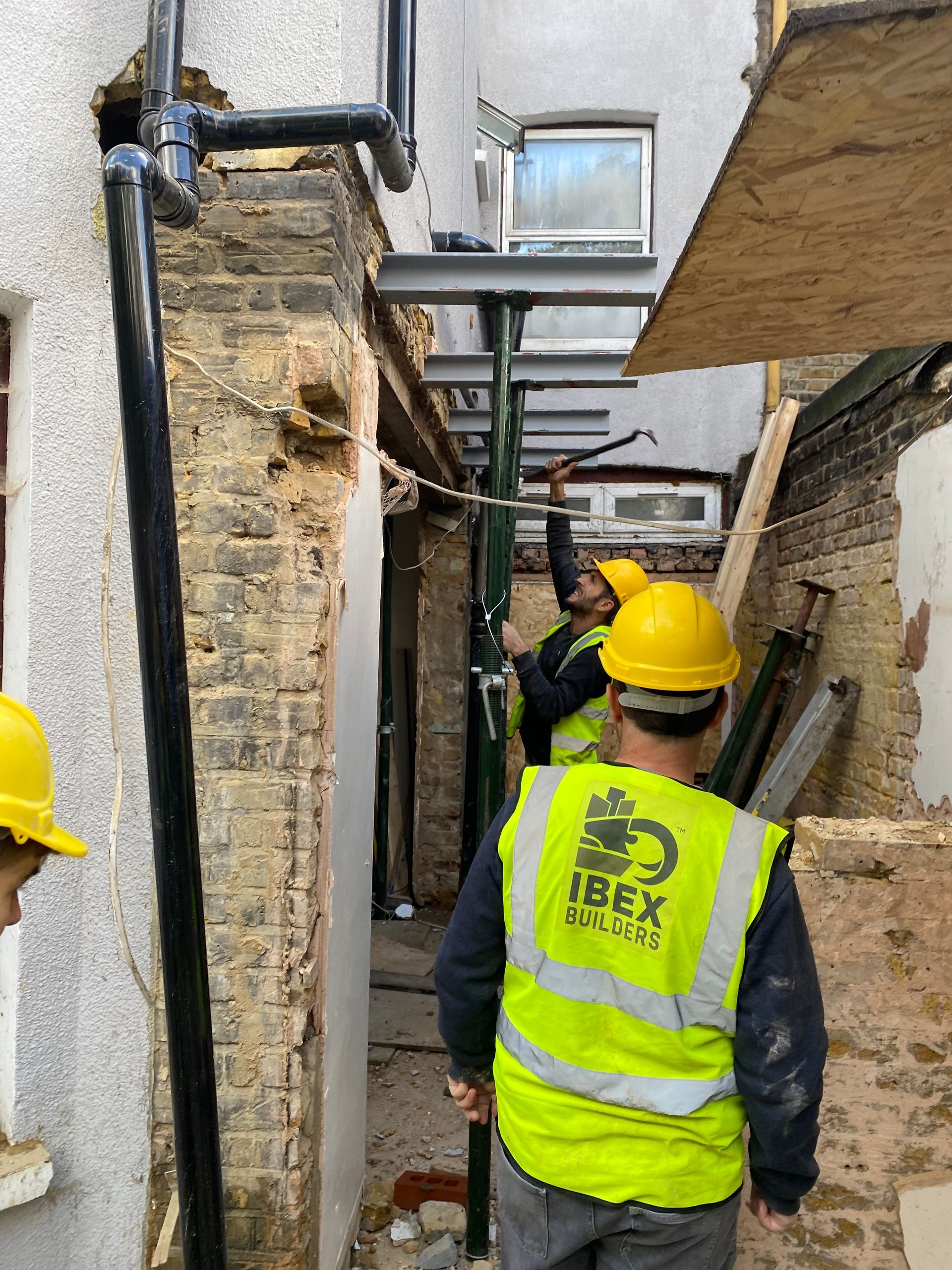 Ibex Builders team member installing structural steel for a London E17 home extension.