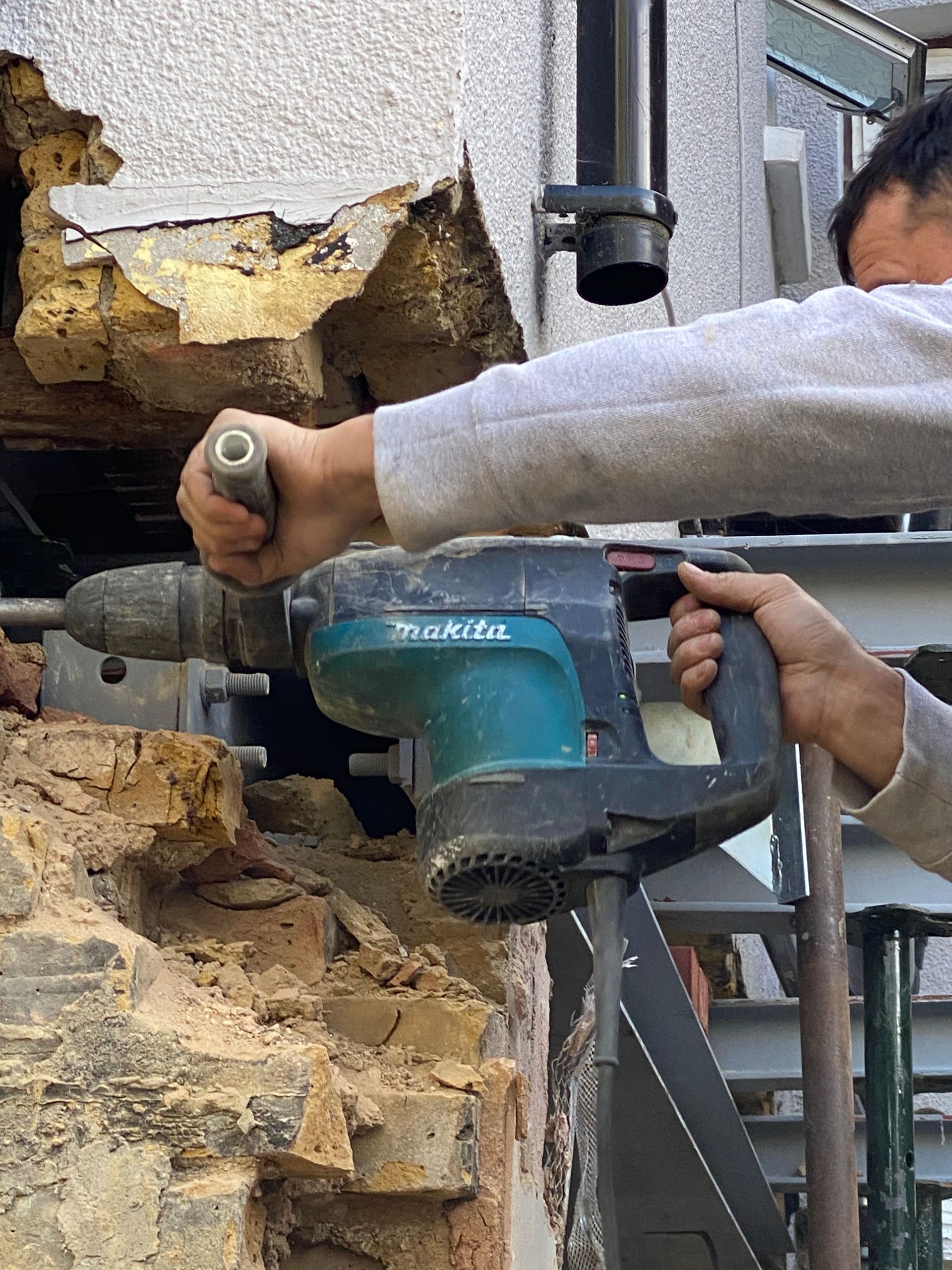 Ibex Builders team using specialist tools for masonry on a Walthamstow kitchen extension.