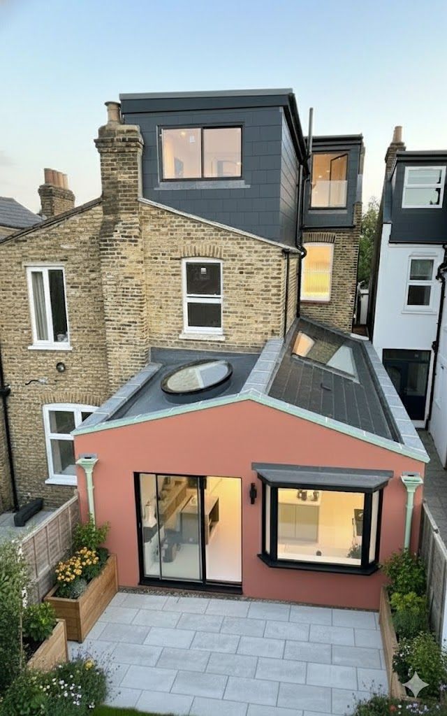 Loft conversion and ground floor kitchen extension. view from the back garden, london house.