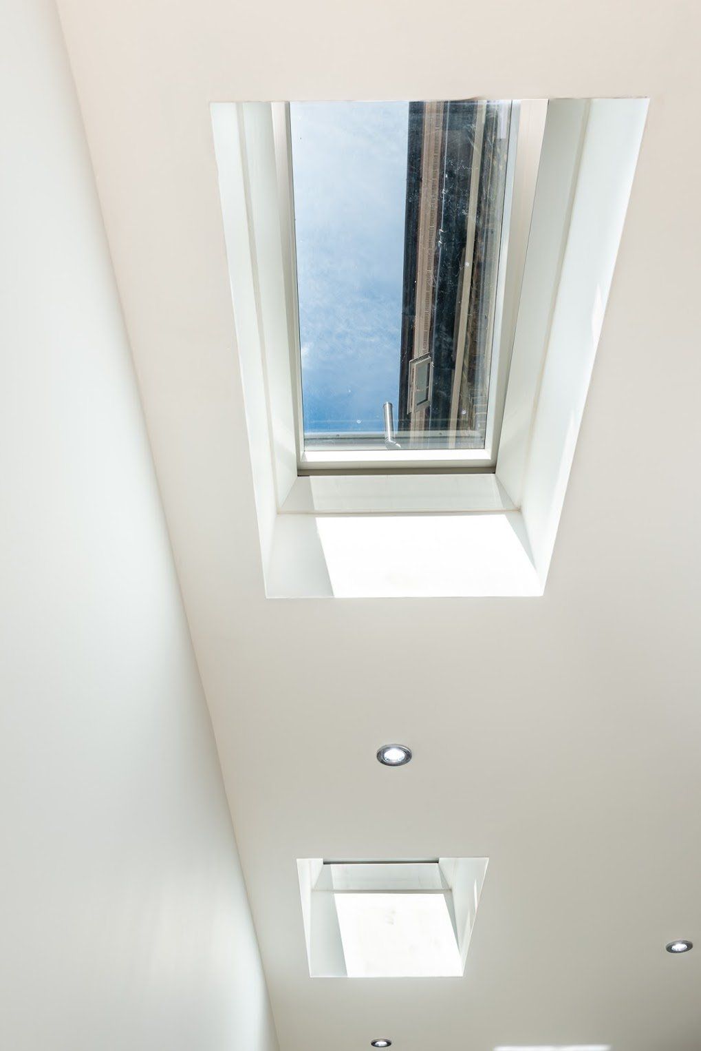 High-angle view through a Velux window in a new loft conversion in Walthamstow E17 by Ibex Builders.