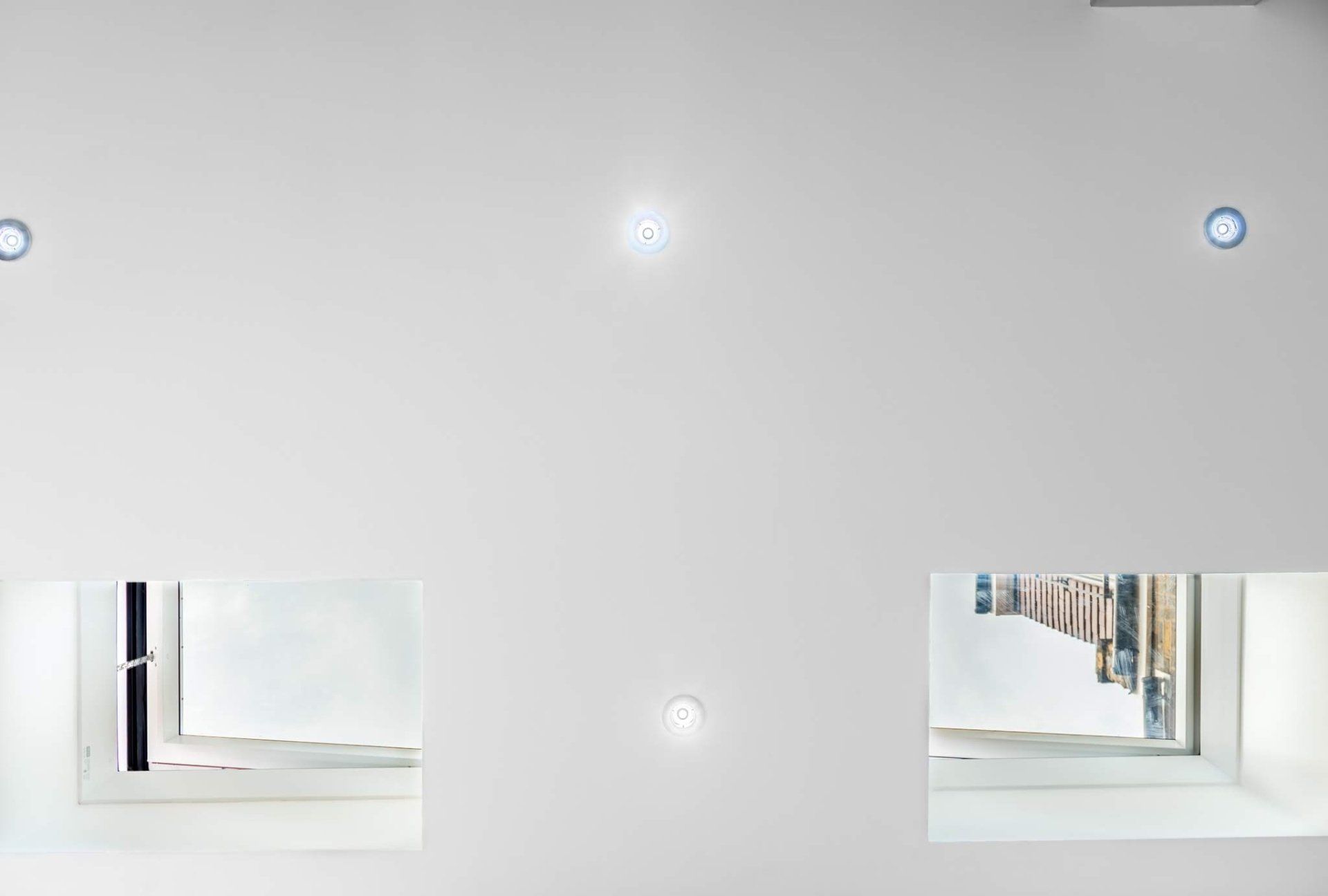 Modern recessed spotlights and sleek rooflights in a newly renovated Walthamstow home by Ibex Builders.