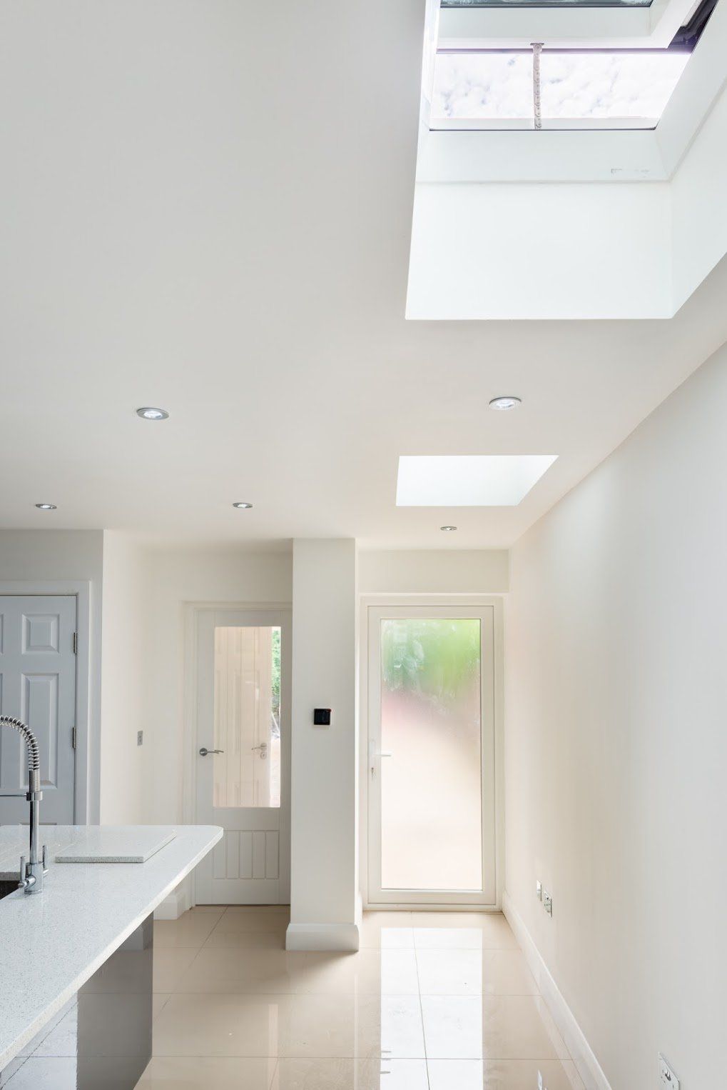Dual electric skylights providing natural light to a Walthamstow kitchen extension by Ibex Builders.