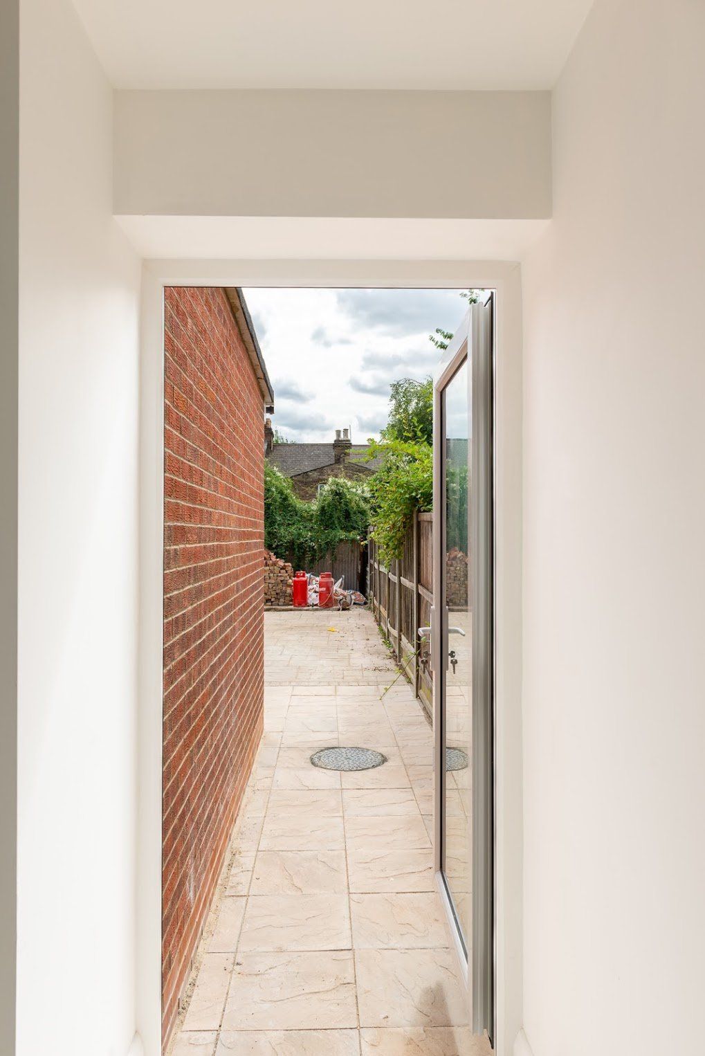 Internal view looking out of a newly installed loft conversion window in Walthamstow by Ibex Builders.