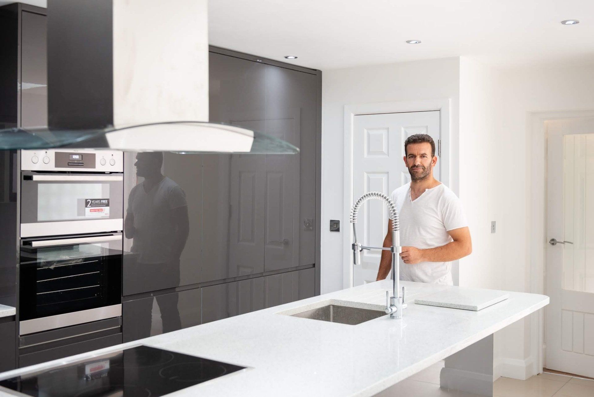 Bright modern kitchen extension  in Walthamstow E17 featuring a central island by Ibex Builders.