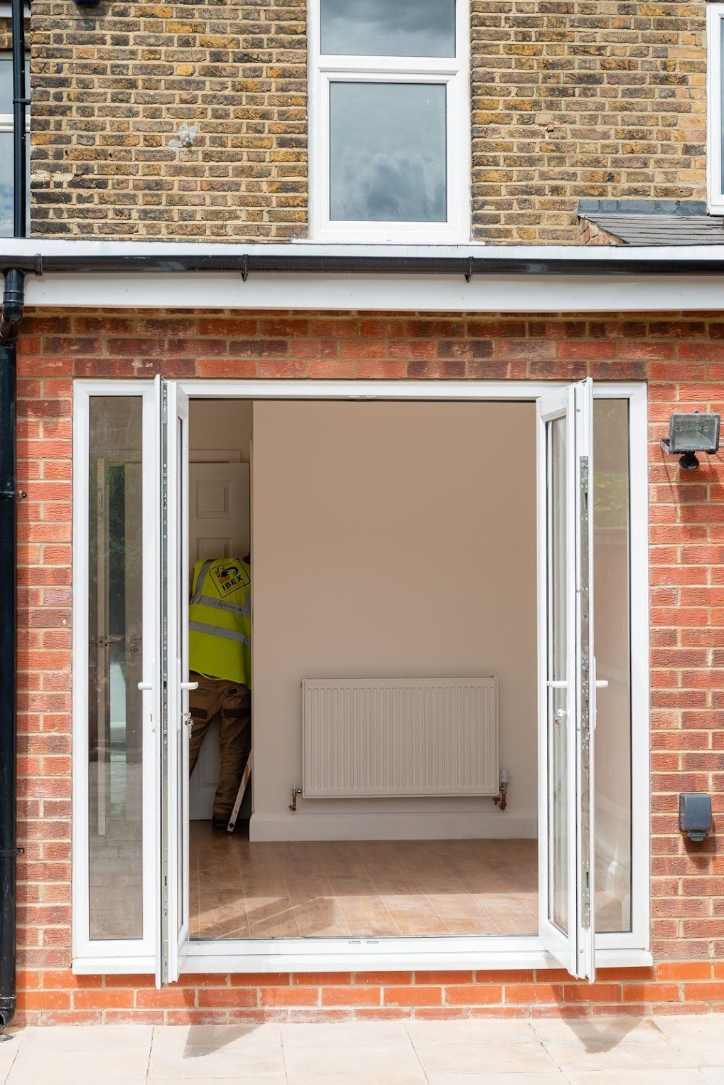 Modern bifold doors and window installation on a kitchen extension in Walthamstow by Ibex Builders.