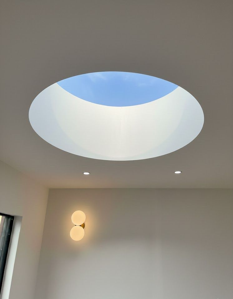 Modern round skylight window in a Murchison Road home extension by the expert Ibex Builders team.