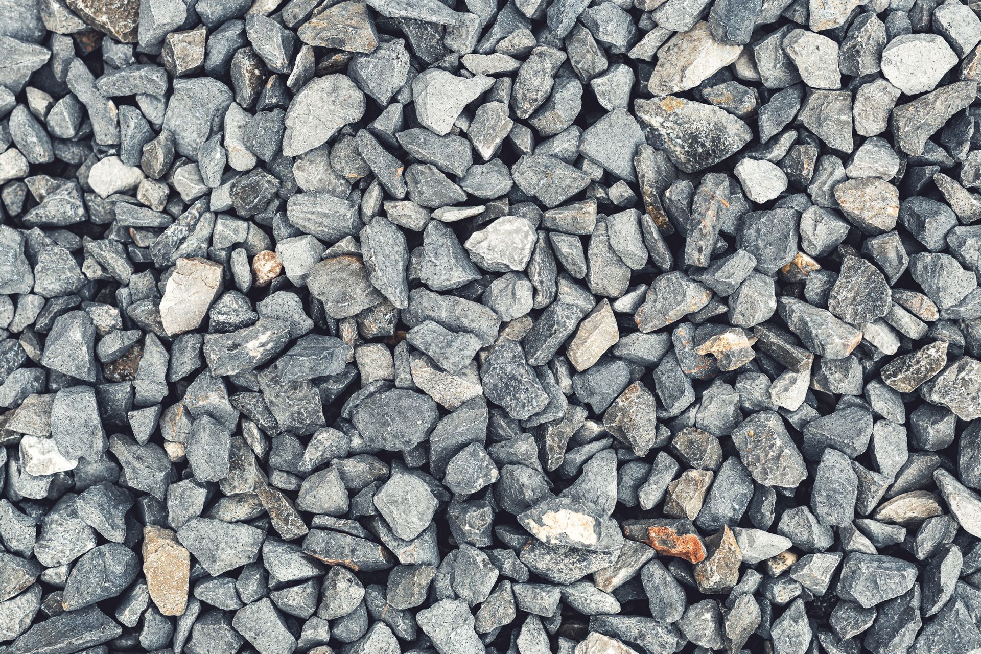Gravel: Small, gray and tan rocks covering a surface.