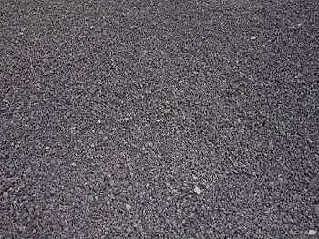 Dark gray gravel surface.