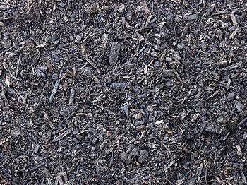 Black, granular material, likely charcoal or ash, densely packed with various-sized pieces.
