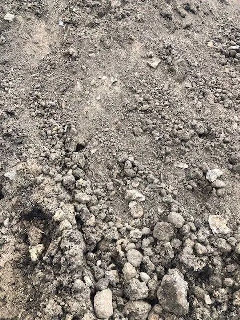 Pile of gray dirt and small rocks.