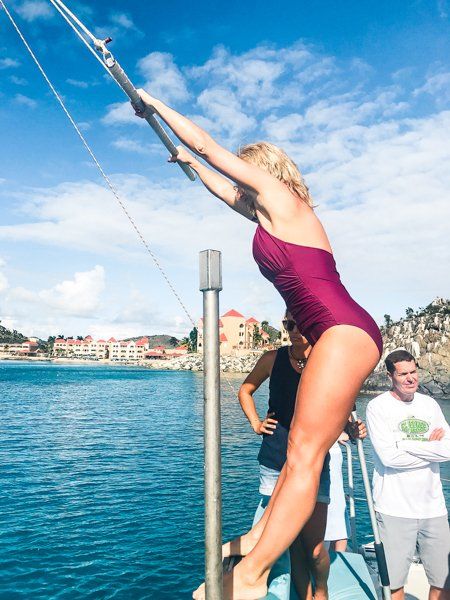 Woman using Tarzan Swing on Random Wind Yacht