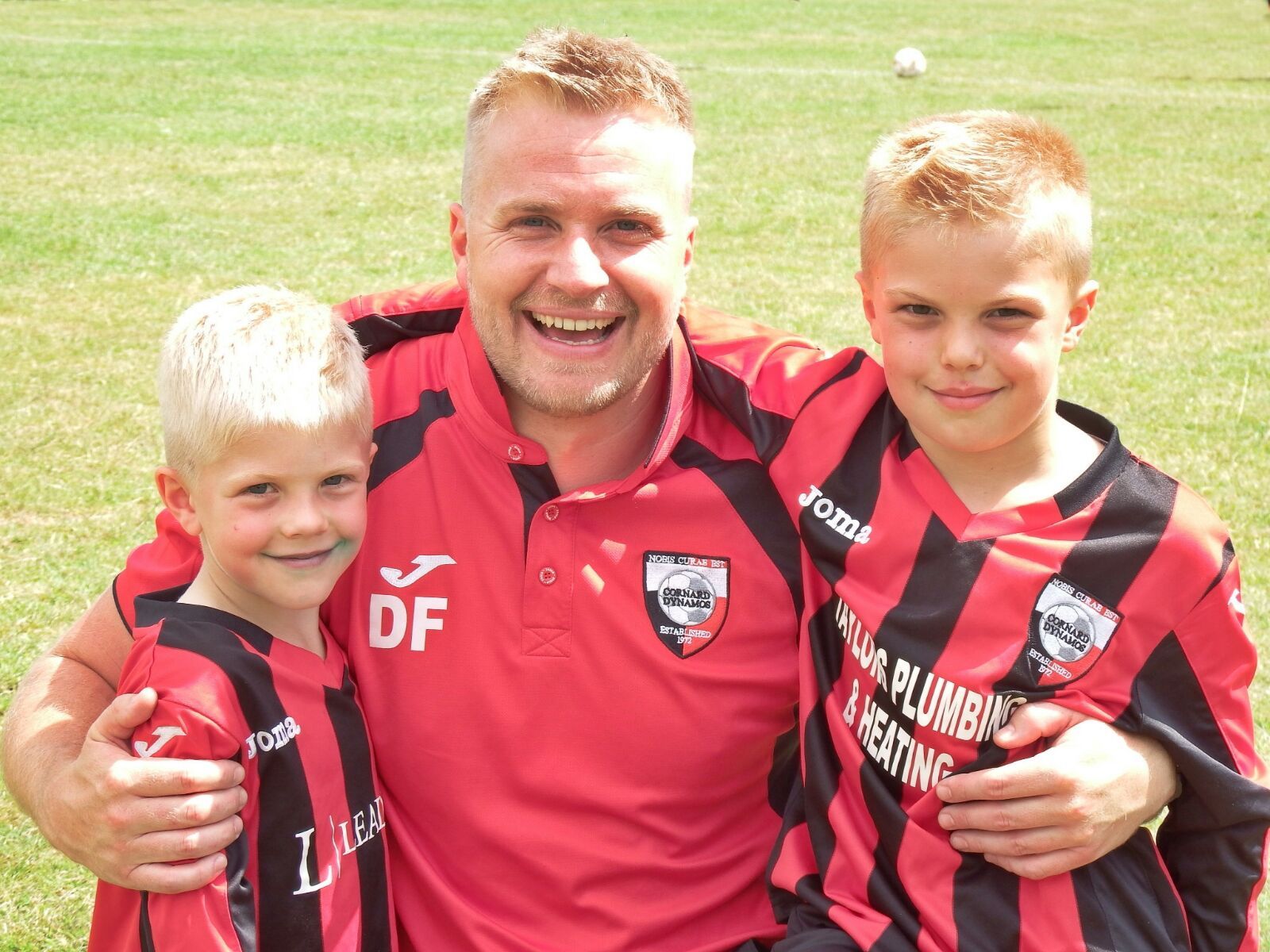 Darren Frost with sons at football
