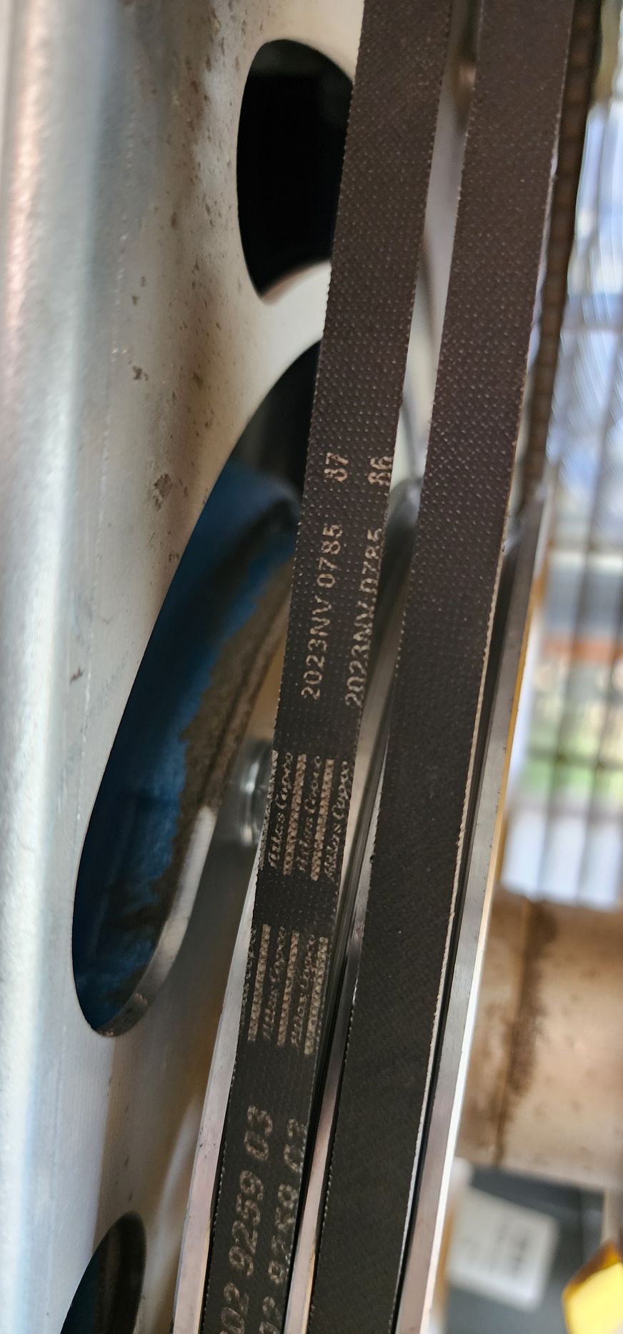 A close up of a belt on a car wheel.