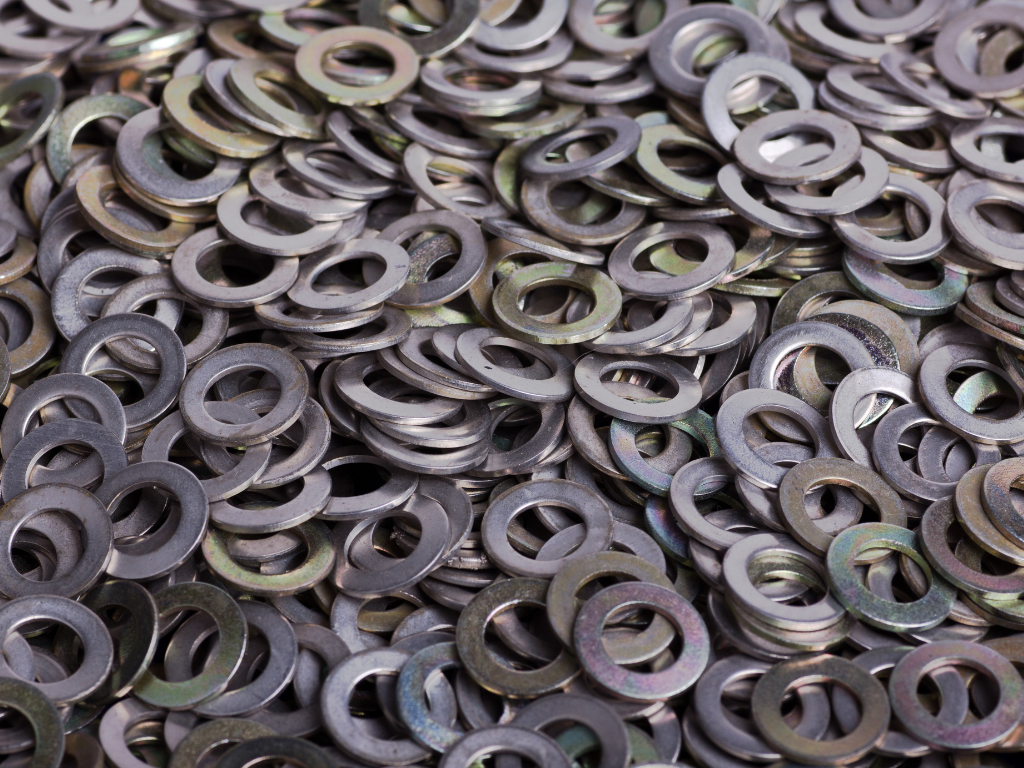 A pile of washers is sitting on top of each other on a table.
