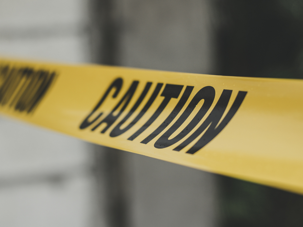 A close up of a yellow caution tape