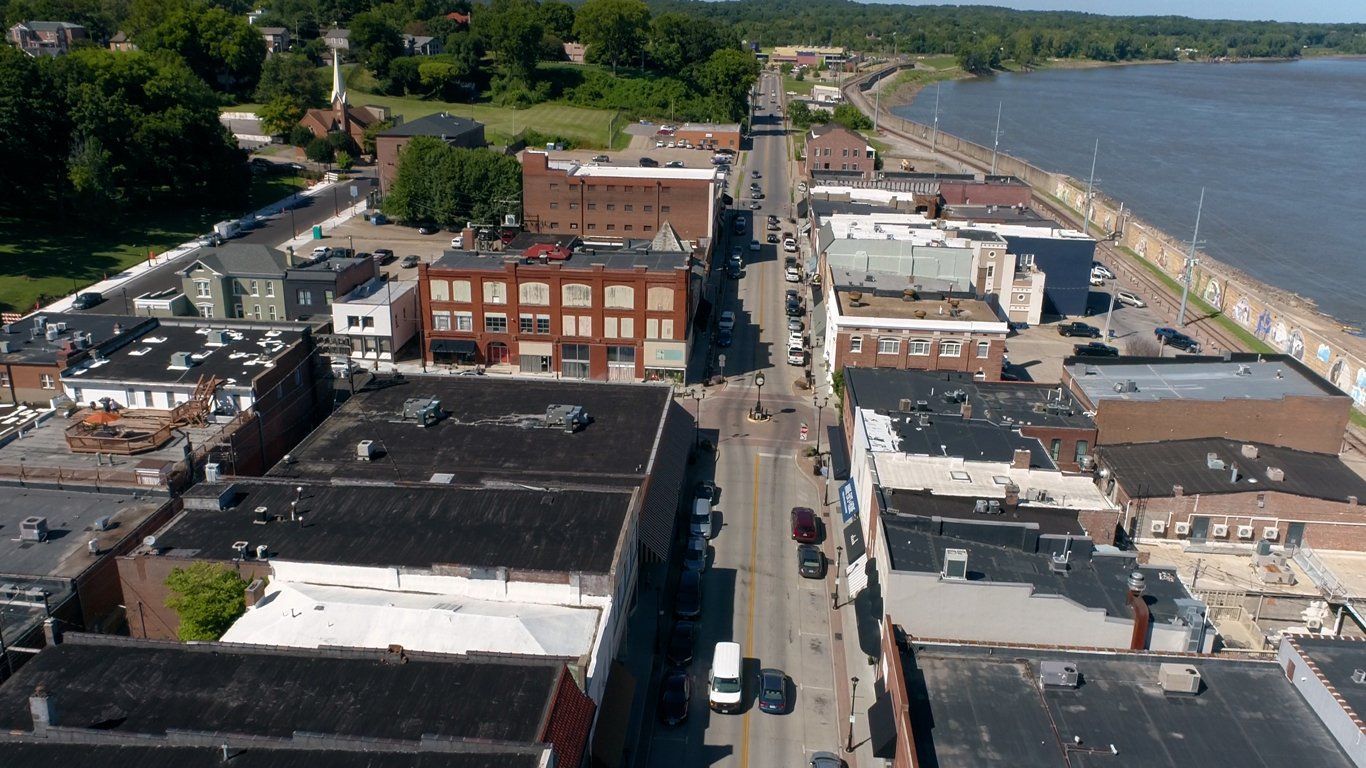 An aerial view of a small town next to a body of water