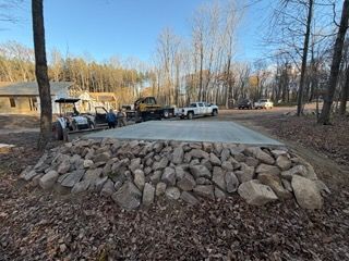 Rake smoothing wet concrete, preparing for a pour. Close-up, outdoor setting.