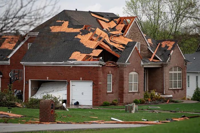 Home in Aurora that has wind damage on the roof