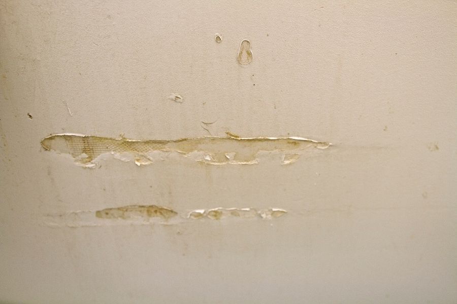 Cracked and damaged walls from moisture exposure