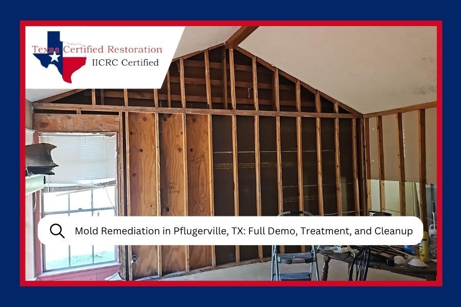 Partially framed interior wall under construction with insulation and roof trusses visible