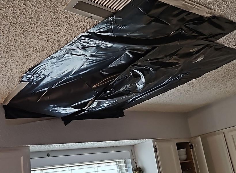 containment barrier over the ceiling hole