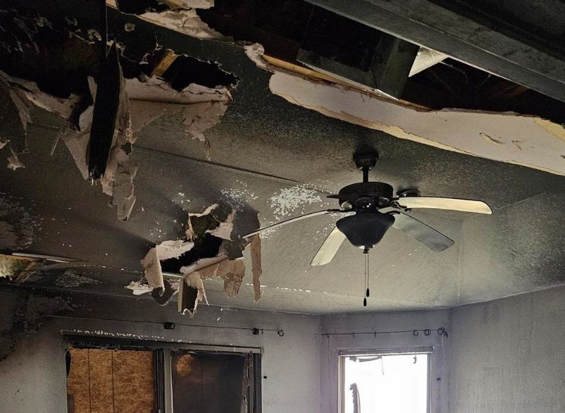 fire-damaged ceiling, drywall, and fan