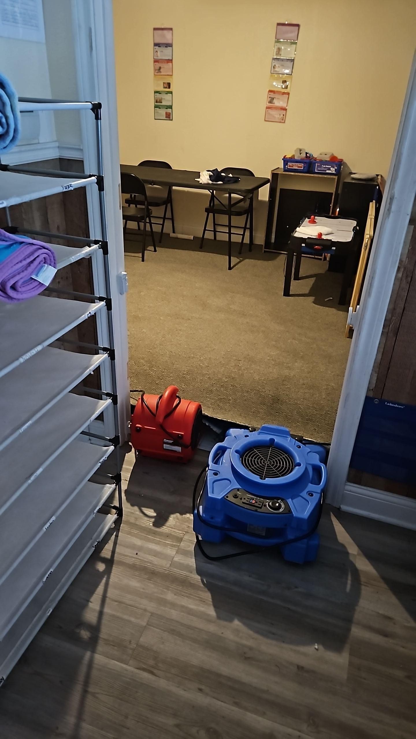 Flooring restoration in progress with drying equipment