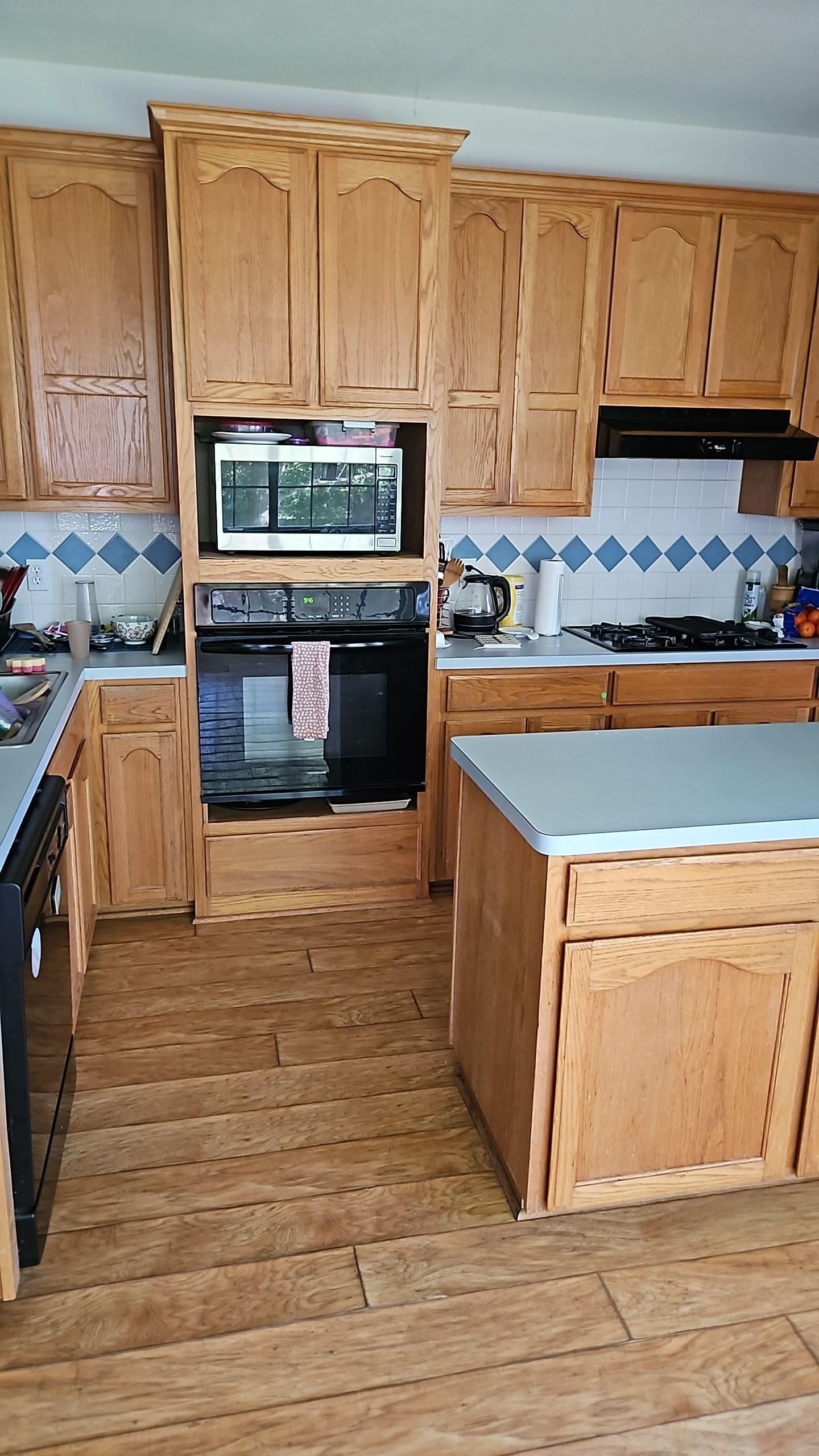 Kitchen flooring damaged by water from refrigerator line leak