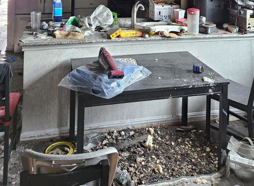 kitchen peninsula, table, and chairs damaged