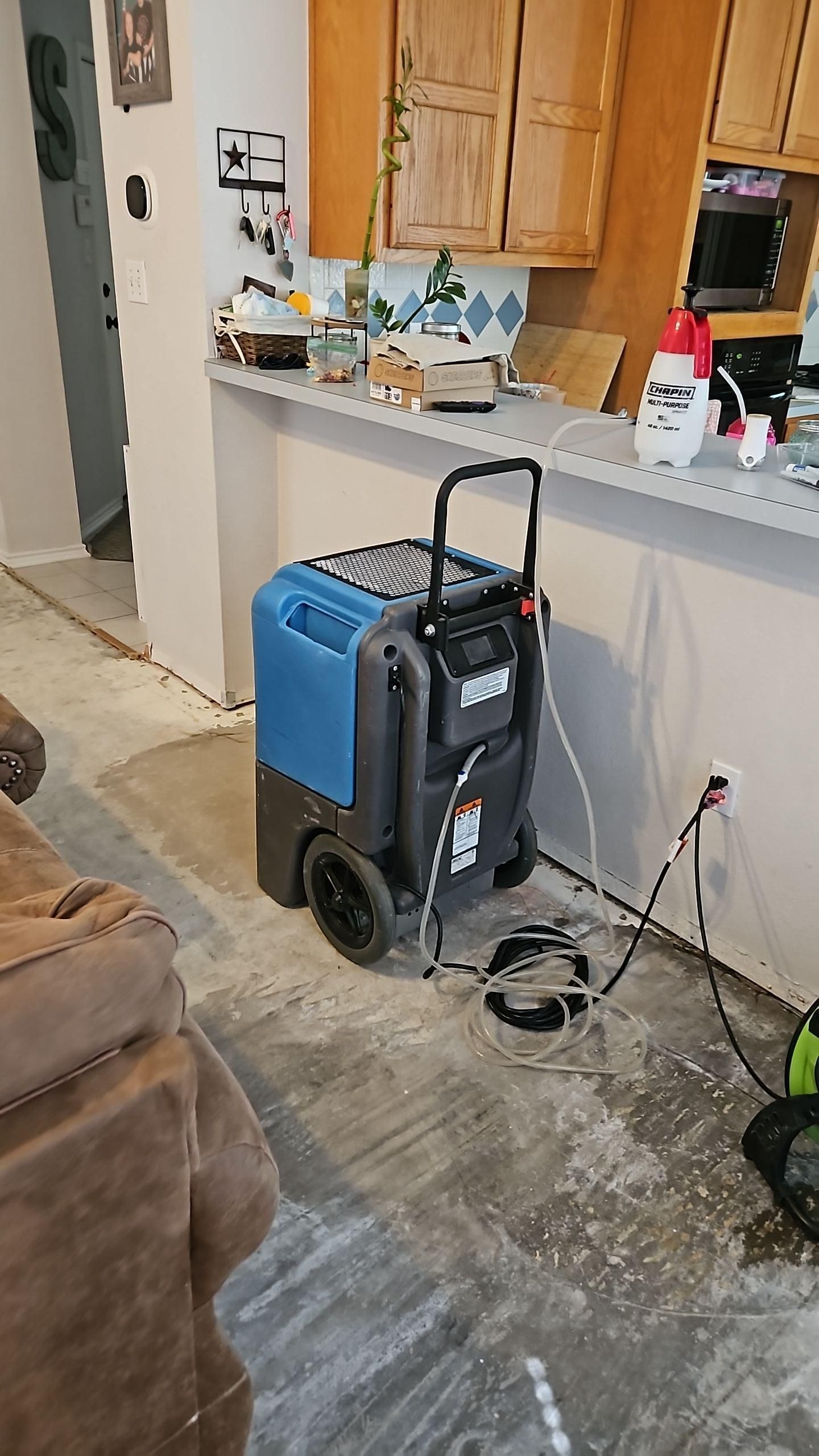 Air movers drying living room after water damage
